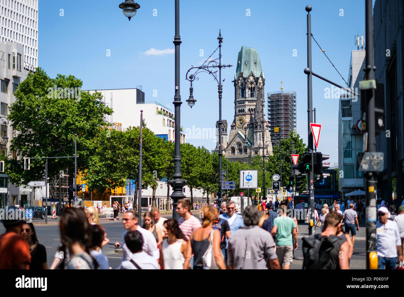 Berlin, Germany - june 09, 2018: People crossing street at Berlin`s most famous shopping district, the  Kurfuerstendamm a.k.a. Kudamm on a sunny day Stock Photo